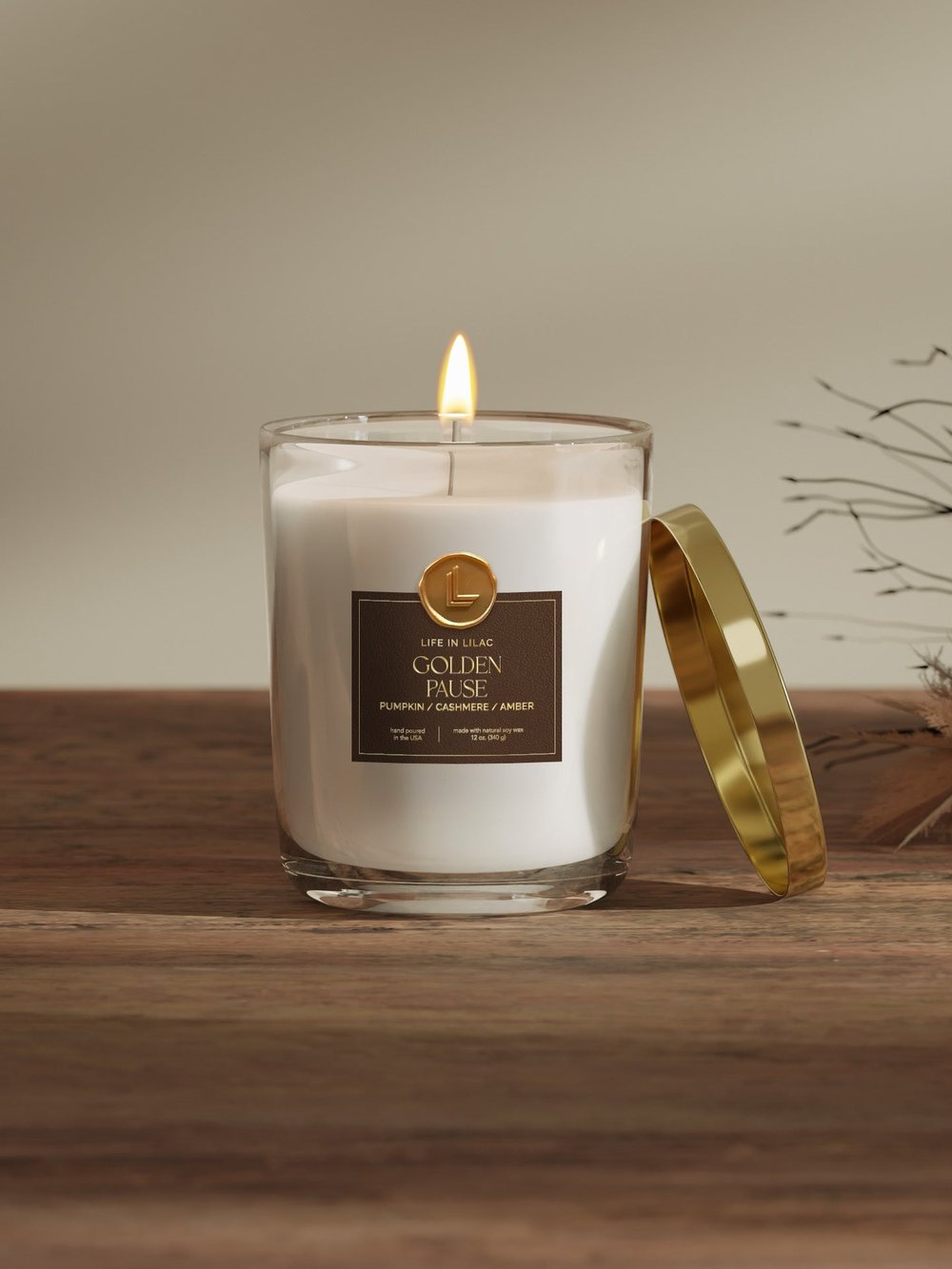 Golden Pause soy candle in a clear jar with gold lid